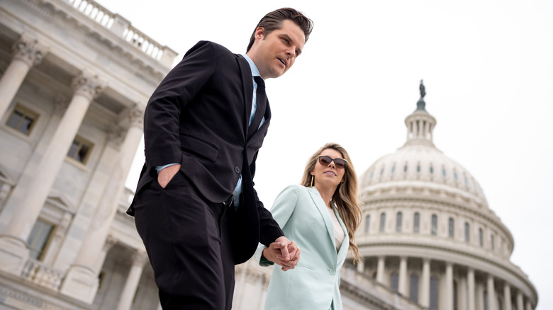 Matt Gaetz and Ginger Luckey exiting building