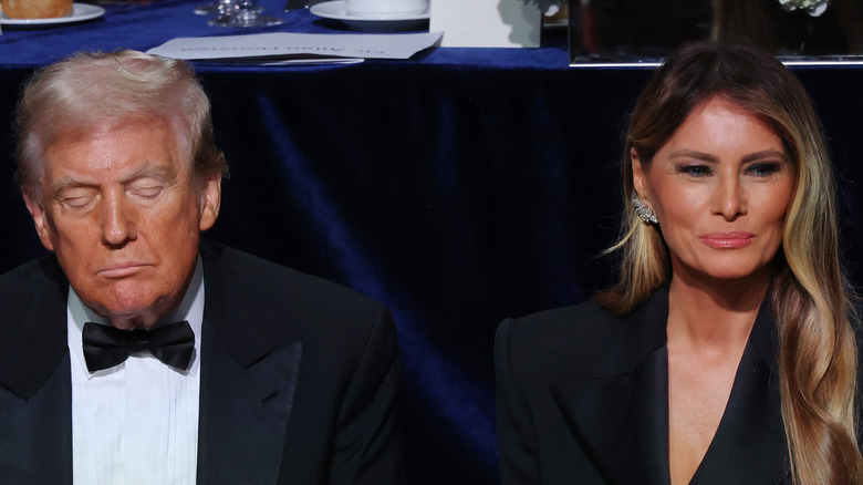 Donald Trump with eyes closed with Melania Trump