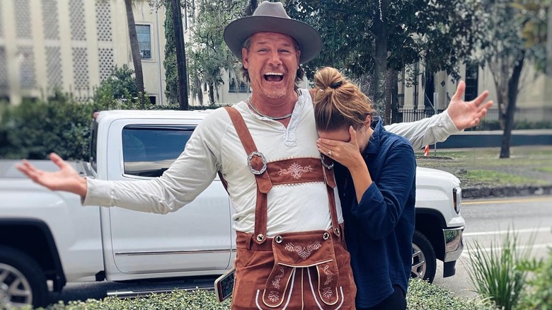 Ty Pennington smiling while Kellee Merrell hides her eyes