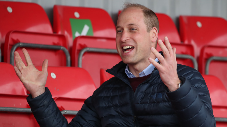 Prince William throwing hands up