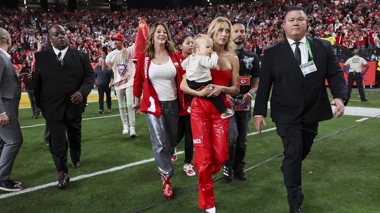 Brittany Mahomes walking on a football field