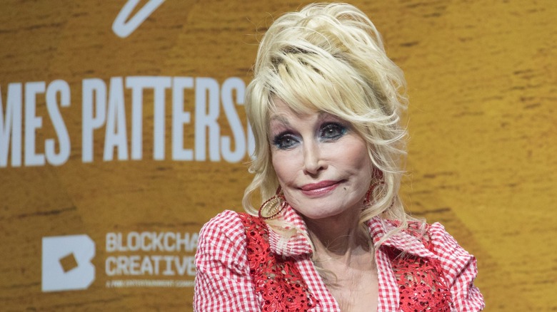 Dolly Parton wearing a blonde wig