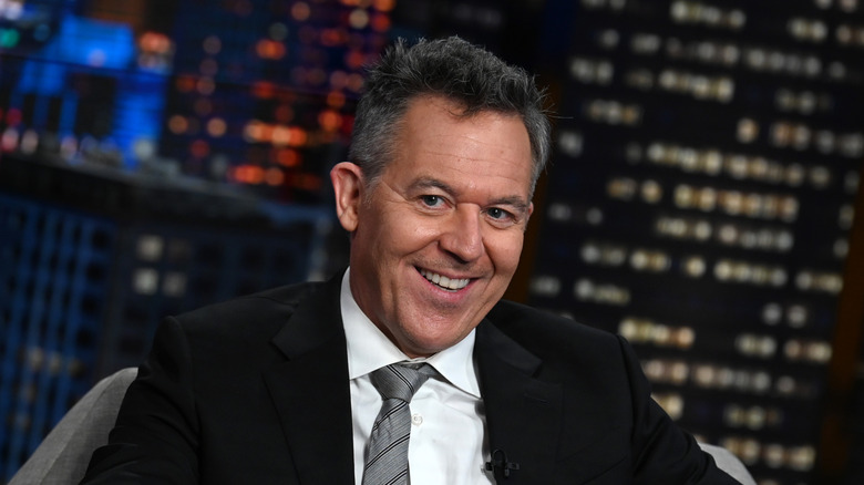 Greg Gutfeld smiles