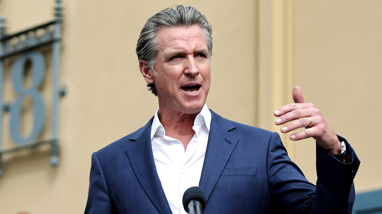 Governor Gavin Newsom addresses a crowd at a press conference in October 2024