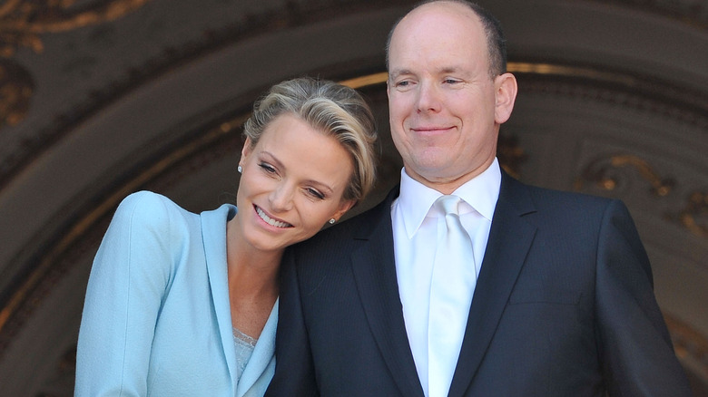 Princess Charlene leaning into Prince Albert