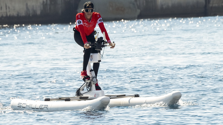 Princess Charlene on a water bike