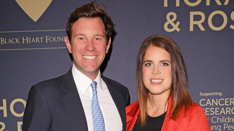 Princess Eugenie and Jack Brooksbank smiling at event