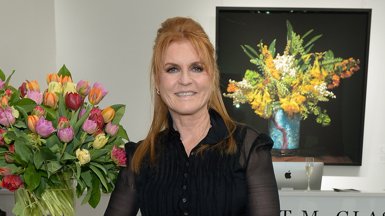 Sarah posing at gallery opening in 2019 