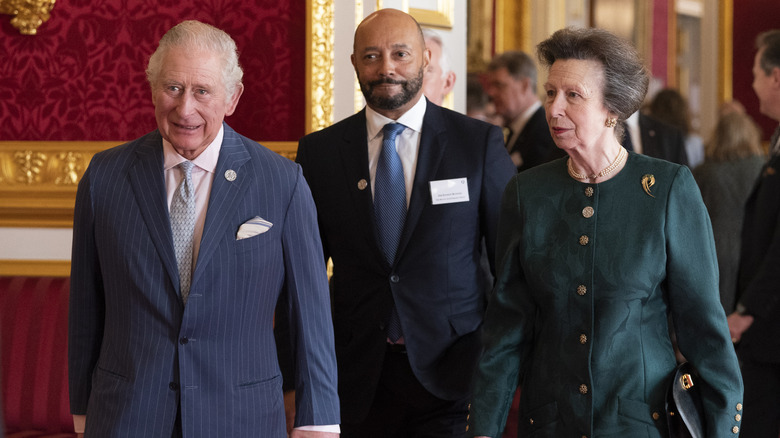 King Charles and Princess Anne walking 