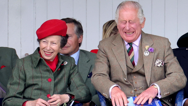 King Charles and Princess Anne laughing  