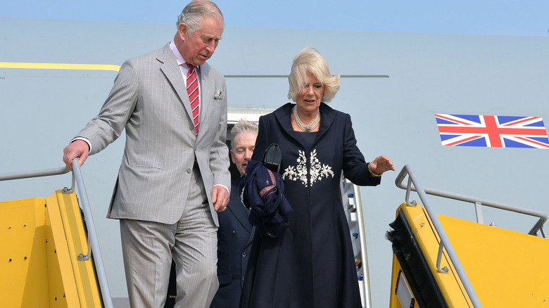 Charles and Camilla leaving plane