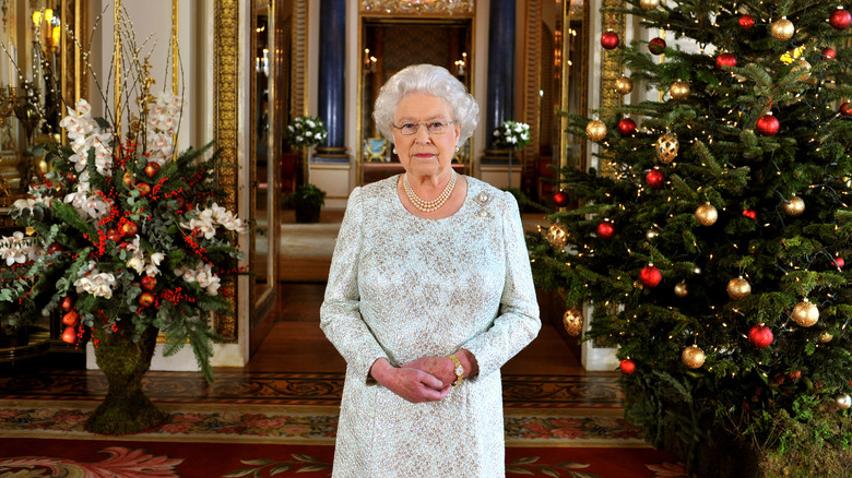 Queen Elizabeth pictured with a Christmas tree