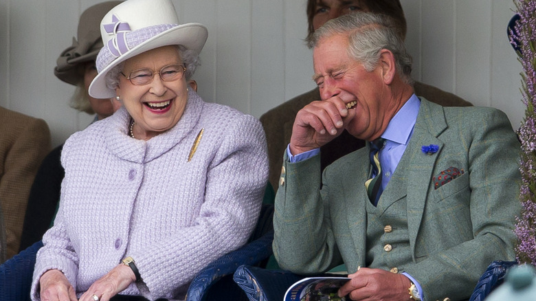 Queen Elizabeth and King Charles laughing together