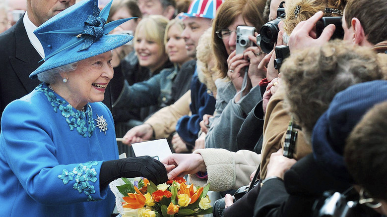 Queen Elizabeth greeting members of the public