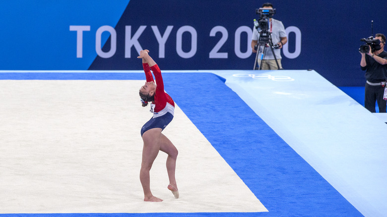 A gymnast performing a floor routine 