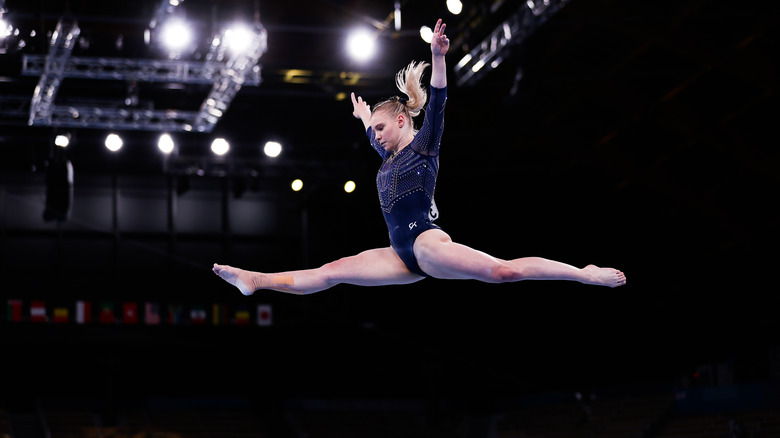 A gymnast performing a split 