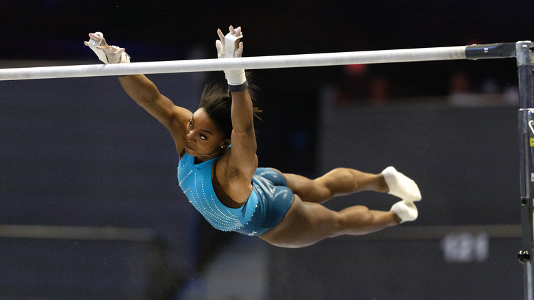 Simone Biles performing on the uneven bars