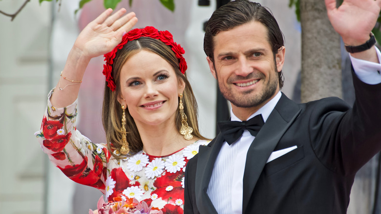 Princess Sofia and Prince Carl Philip waving