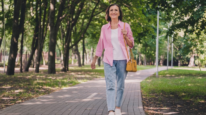 A smiling woman walking 