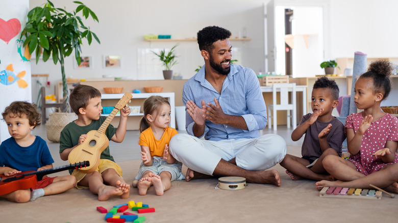 Teacher and children at daycare