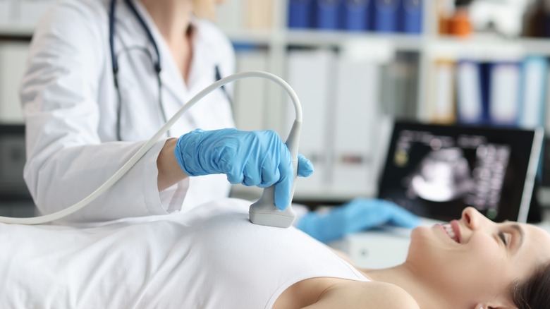 woman having breast ultrasound