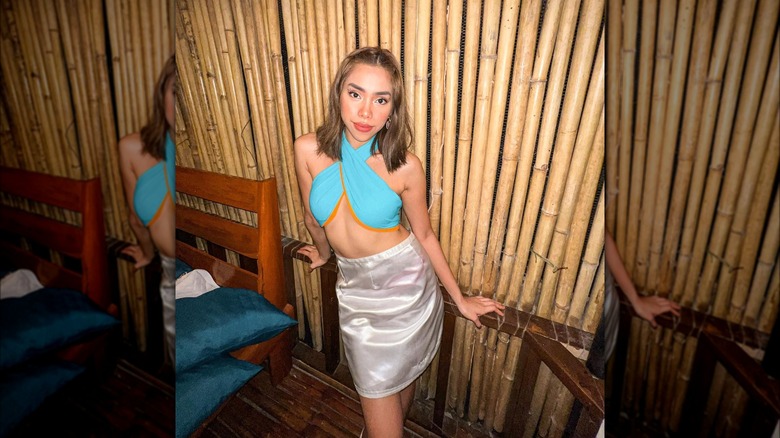 @jaiagpangan wearing skirt and cross-body halter