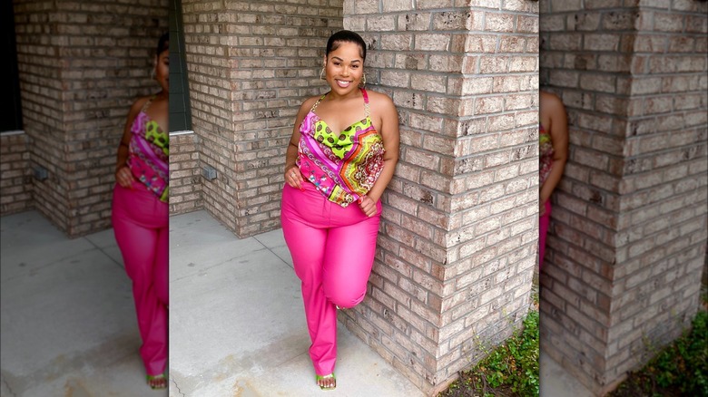 @thekrystalhall wearing pink pants and patterned halter top