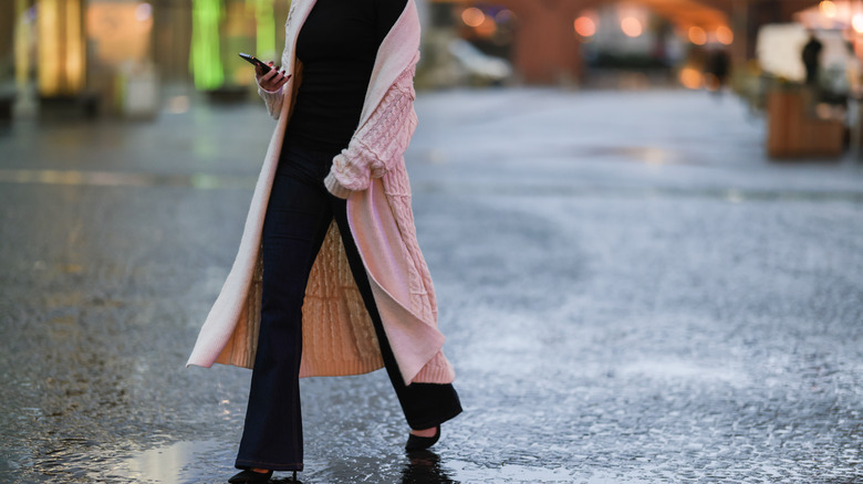 Woman walking outside in sweater