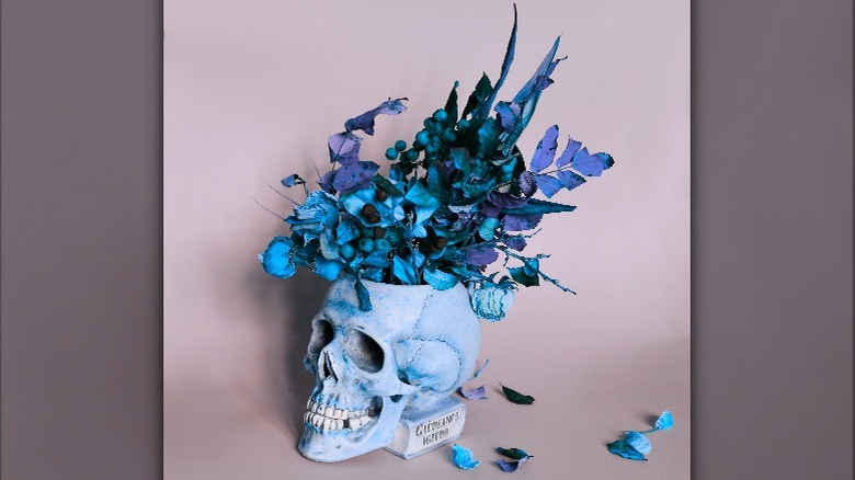 A blue vase shaped like a skull