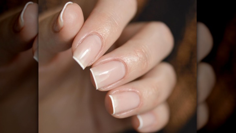 hand with micro french manicure