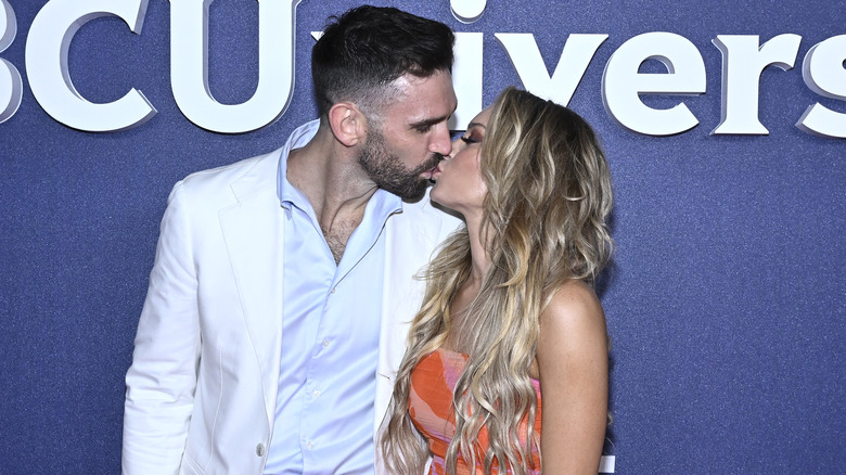 Carl Radke and Lindsay Hubbard kissing at event 