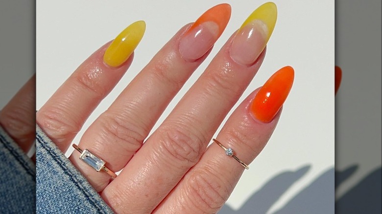 Closeup of orange and yellow manicure