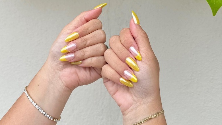 Hands with lemonade nails