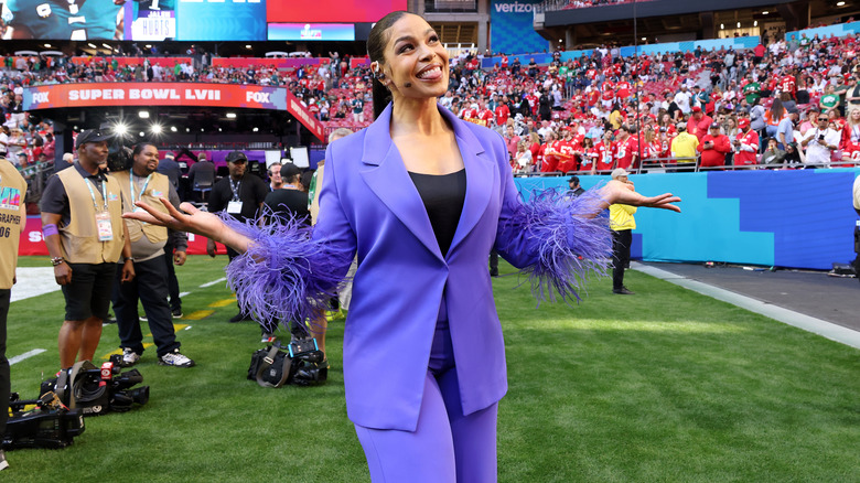 Jordin Sparks in a purple suit with feathers on the sleeve cuffs