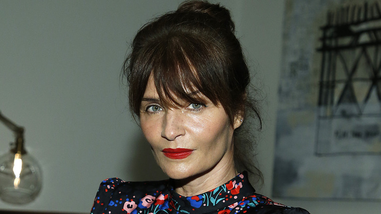 Helena Christensen wearing red lipstick