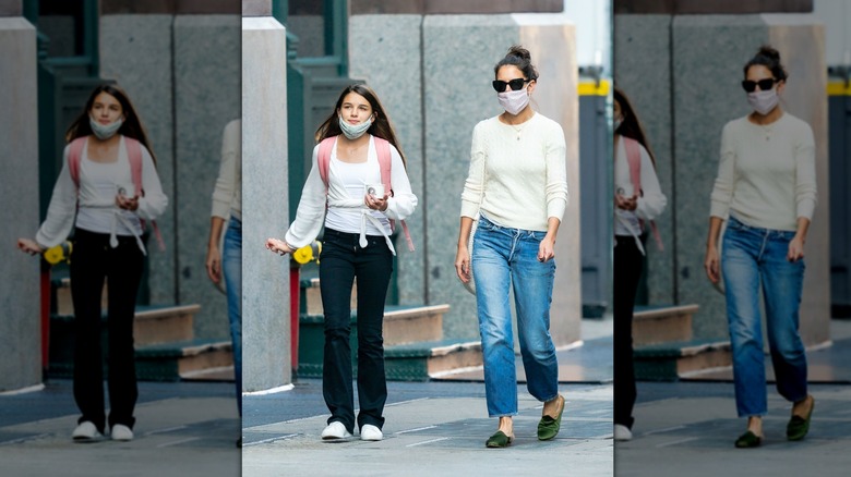 Suri Cruise and Katie Holmes walking in streets