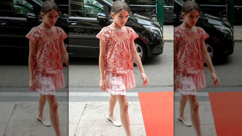 Suri Cruise walking outside