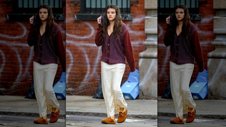 Suri Cruise, walking on a street