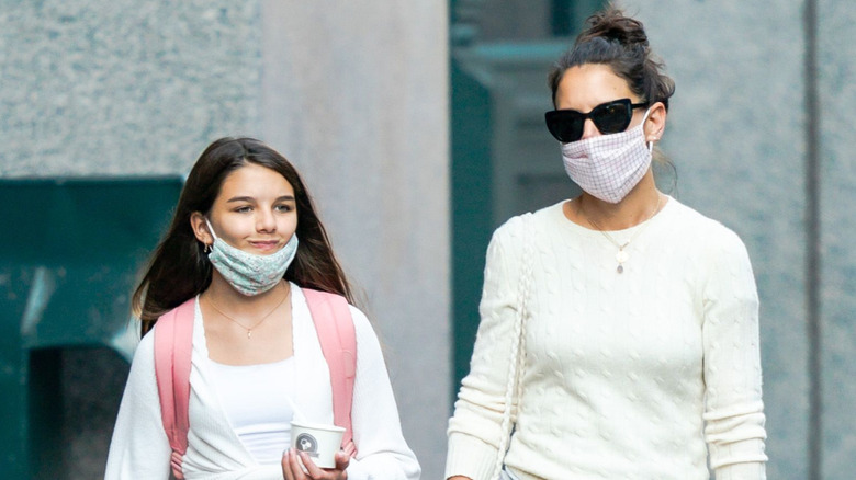 Suri Cruise and Katie Holmes take a walk