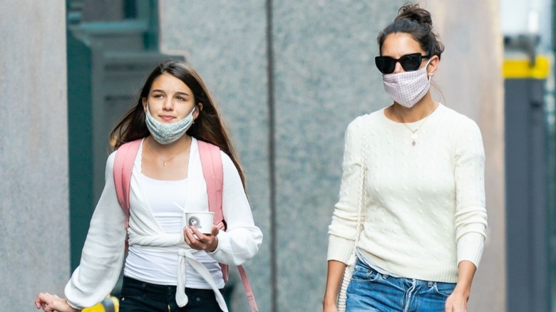 Suri Cruise and Katie Holmes with masks on