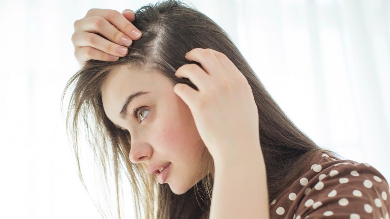 woman hair falling out