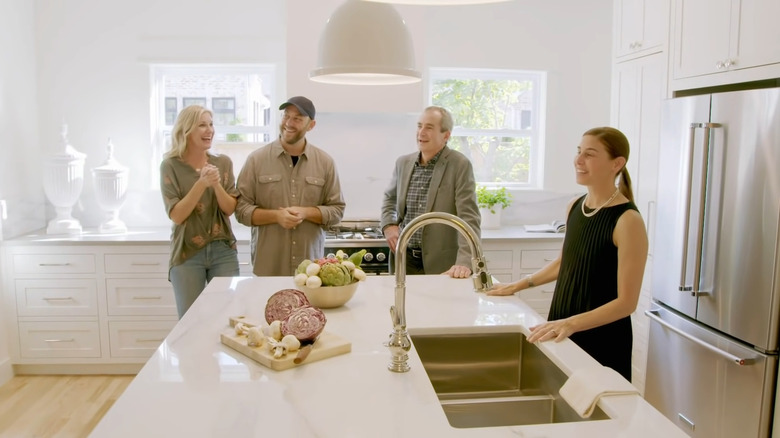 Fixer to Fabulous cast & contestants standing in kitchen