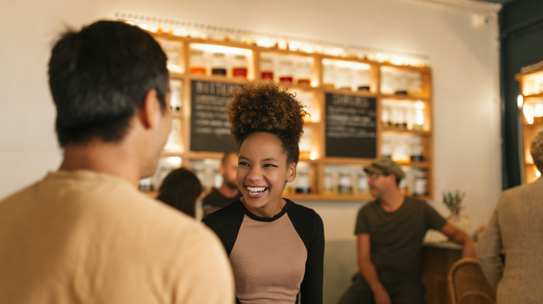 woman laughing with man