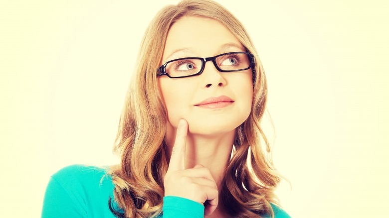 attractive woman with glasses and head tilt