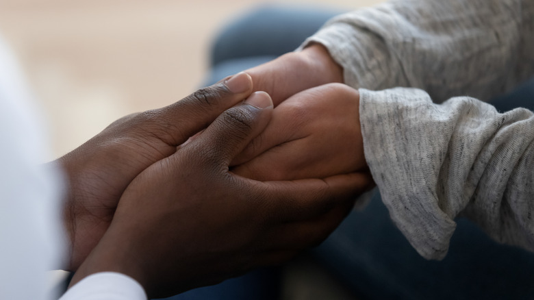 Black couple's hands 