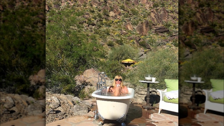 Suzanne Somers in an outdoor bathtub