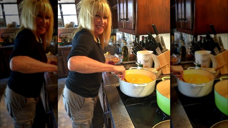 Suzanne Somers cooking in her kitchen