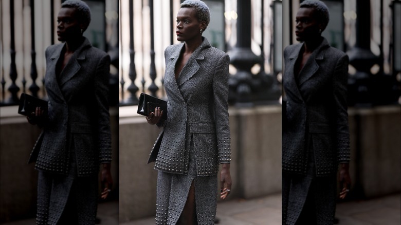 Woman wearing studded skirt suit as workwear