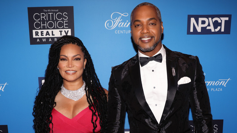 Egypt Sherrod and Mike Jackson smiling in formal wear