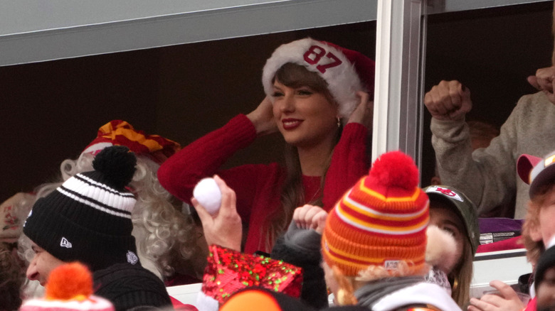 Taylor Swift wearing a Santa hat 